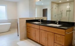 Bathroom remodeling project with updated shower, vanity, and tile work in Bellevue